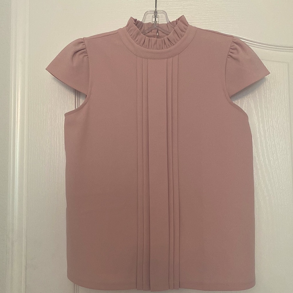 Powdery pink top from Ann Taylor. Small size. It was worn only once.